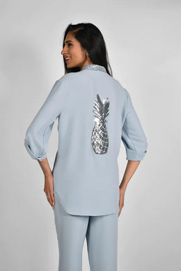 Command attention with this sparkling pineapple top by Frank Lyman.  A gorgeous, chic top, our Polina is the perfect style to wear when going out to lunch or out to a casual dinner.  Pair with your favorite white pants or denim for the ultimate polished look.  Color- Light blue and silver. Tab sleeves. Button up. Perfect coverage.