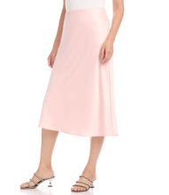 Load image into Gallery viewer, Cut from luxurious satin, this figure-flattering skirt is cut on the bias for a stunning drape. This versatile skirt can easily transition you through the seasons with ease. It features an elastic waistband for comfort.  Pair this fabulous skirt with our ROSE TURTLENECK SWEATER (Pictured) or our ROSE TIE-FRONT BLOUSE for a monochromatic look.
