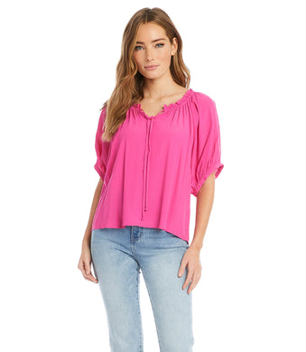 Your summer wardrobe is not complete without a top that offers a pop of color!  This gorgeous azalea pink, short sleeve top, has a great deal of interest and beauty offering so many options when it comes to pairing with bottoms. Details include a subtle ruffle edging around the neckline, front ties and cuffs at the sleeve, creating a lovely feminine style.