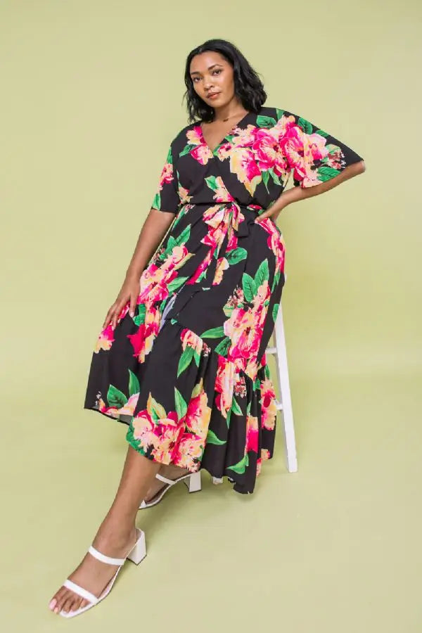The Ellie Woven Maxi Dress is so stunning with a black background and a floral print that just pops!  This gorgeous style features a surplice neckline and is a true wrap design with a ruffled hemline. A dress for those perfect moments in your life.