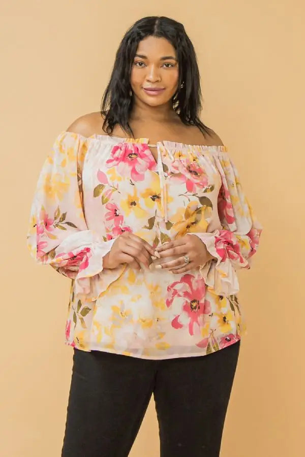 A beautiful off the shoulder neckline enhances the beauty of this top and the detailing is even more spectacular! Ruffled cuffs and front edge as well as front ties give the Gaby an edge that is eye appealing! Wear casually with jeans or dressed up with your favorite bottoms and you will feel like a star in this top!