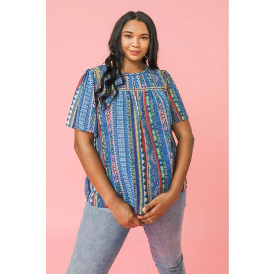 The Halle Flutter Sleeve Top has a gorgeous Aztec pattern that you won't see anywhere else!  A round neckline with square yoke and a shirred front and back add detail to this lovely top while a keyhole button closure and flutter sleeves create even more interest.
