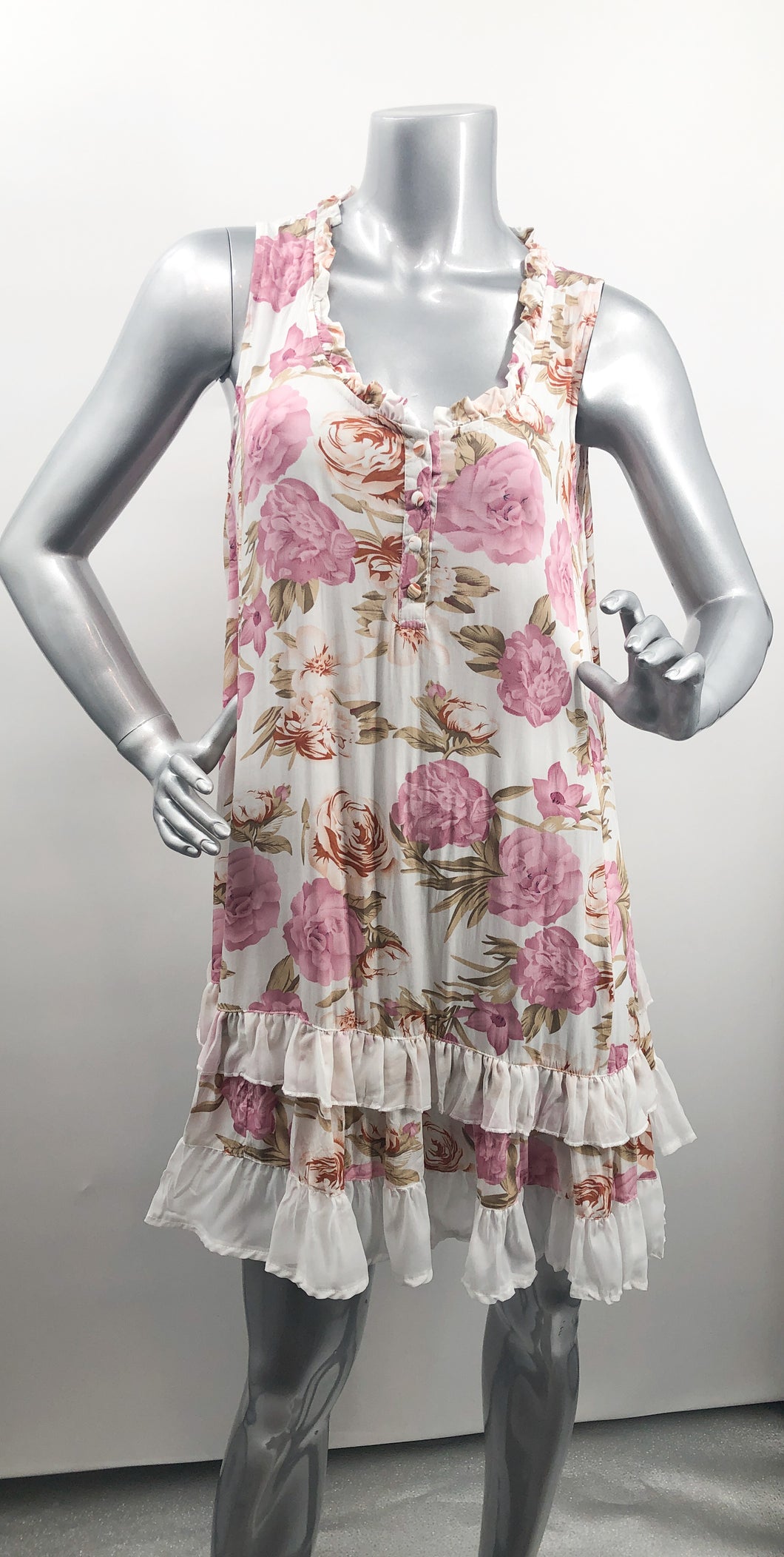 If you are looking for a summer dress that can be worn for many occasions, our Polly Pink Floral Two-Tiered White Ruffle Hem Dress is the one!  A beautiful pink and light olive-green floral pattern on a white background creates a feminine flair while the two-tiered hem with white ruffles creates a fashionable look.  