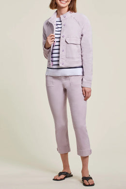 An easy and stylish crop, our Posie pull on crop in a beautiful soft lilac color called grapemist will become your go to pant of the season.  Perfect stretch and a button tab accent detail at the hemline gives this pant an edge. Pair with your favorite white or black tee and a pair of tennis shoes or sandals and you're ready to face the day in style.  Color- Grapemist; soft lilac. Perfect stretch. Pull-on.