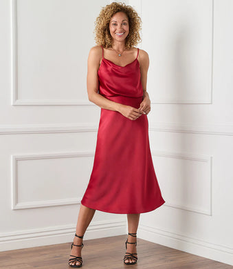 Cut from luxurious vintage heavy satin, this top is detailed with an alluring draped neckline. The perfect layering piece - soft, shimmering, and easy to dress up or down. Color- Choice of red or ivory. Adjustable straps. Lined. Vintage heavy satin.