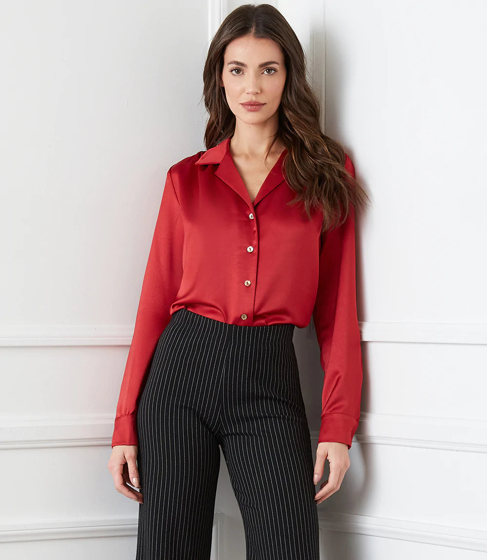 Cut from luxurious vintage heavy satin, this top is detailed with a polished notched collar and cuffed sleeves. The perfect layering piece - soft, shimmering, and easy to dress up or down.  Color- Red. Button down. Vintage heavy satin. Button cuff.