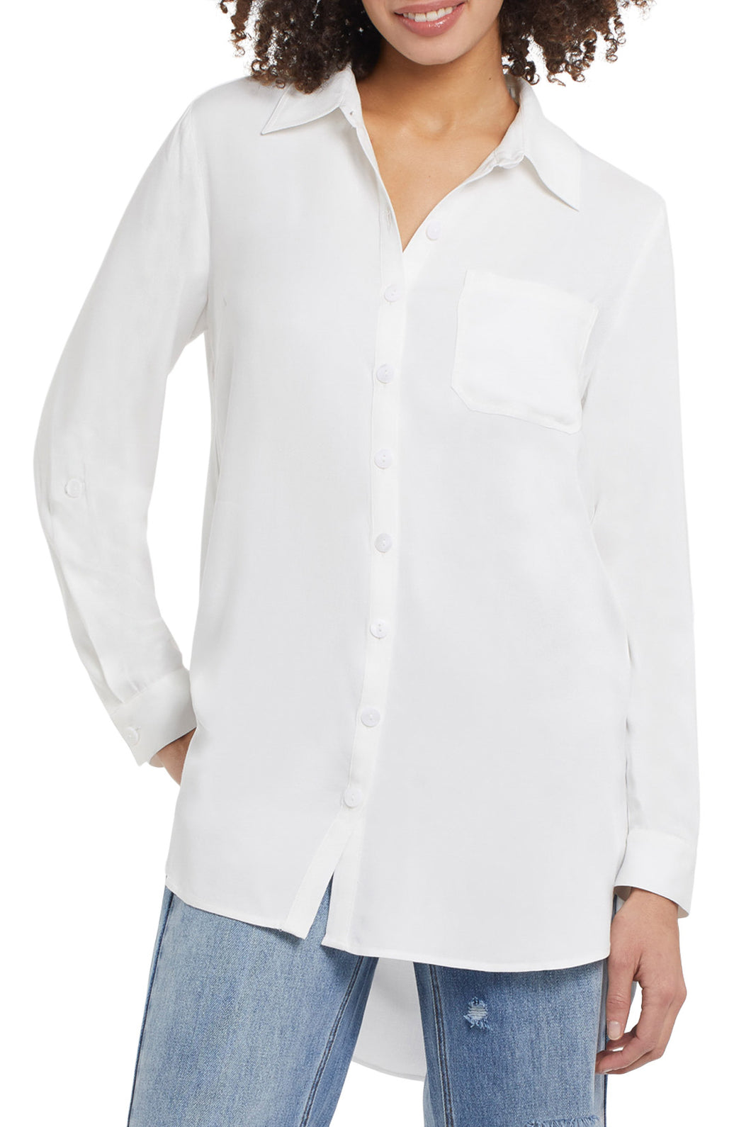 There's nothing better than a flowy tunic top to elevate any outfit! This flowy white button up shirt has all the classic details we love including a hidden button placket, roll-up tab cuffs, a chest patch pocket and curved shirttail hem on a high lo look.  Proudly wear on its own or put under a sweater vest, which is this season's hottest look! 