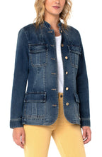 Load image into Gallery viewer,  A fantastic length to this jacket allows it to go well with so many outfits!  Imagine it paired with white jeans, any color/print pant and every style of dress.  The eye-catching details on the Annie makes this denim jacket stand out among other jackets. The patch pockets on the front are fully functional while the buttons are a shiny gold, giving this denim jacket eye appealing detail. 
