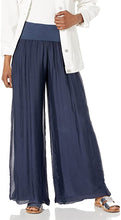 Load image into Gallery viewer, Our beautiful Nadia palazzo pant has an amazing knit fabric underneath a silk overlay.  A flowy and relaxed fit gives this fabulous pant both style and comfort at the same time.  Wear to the beach or to lunch, out to dinner, or a garden party or wear just lounge around the house, you can&#39;t go wrong with this stunning pant.  Pair with our M Made In Italy silk tops for a complete fashionable look!  Color- Navy. Boho, relaxed fit.
