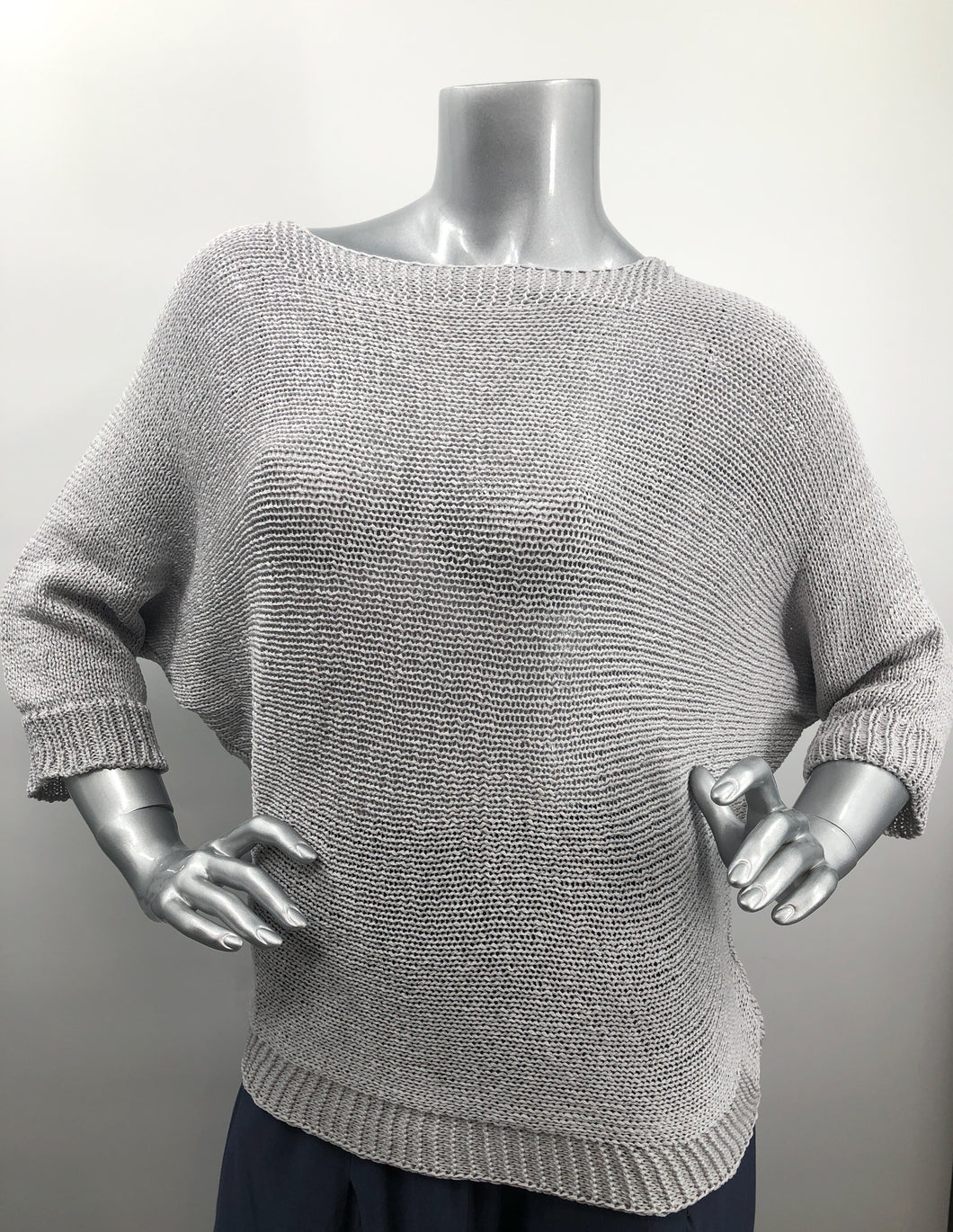 A perfect sweater for all year round, as it is not too heavy and not too light, this knit sweater is fashionable and functional.  The silver-gray color is so on trend and literally goes with so many different bottoms.  As this 3/4 sleeve sweater is not a tight knit, it is slightly see-through.  Wear over a bralette, tank or nude bra if preferred.  