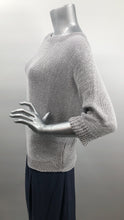 Load image into Gallery viewer, A perfect sweater for all year round, as it is not too heavy and not too light, this knit sweater is fashionable and functional.  The silver-gray color is so on trend and literally goes with so many different bottoms.  As this 3/4 sleeve sweater is not a tight knit, it is slightly see-through.  Wear over a bralette, tank or nude bra if preferred.  
