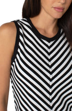 Load image into Gallery viewer, This beautiful sleeveless knit top is a piece that pairs effortlessly with everything from jeans to slacks.  A unique miter pattern provides a slenderizing look while the contrast black fabric on the neckline and around the shoulders sets of the pattern nicely.  A flattering fit, this top drapes nicely on the body.  Fit is true to size.
