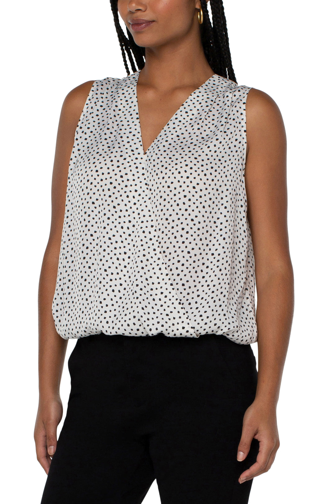 This classic dot printed top features a draped front for the most flattering fit.  The V-neck design elevates the look of this lovely sleeveless top.  A perfect top to match with so many different bottoms from jeans to dress pants.  Create the perfect outfit when paired with our Black Sena Boyfriend Blazer with Princess Seams by Liverpool LA and our Black Kelsey Knit Trouser by Liverpool LA.