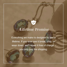 Load image into Gallery viewer, All around allure. This necklace features a rounded-edge, cushion cut stone that is encircled by a vintage inspired decorative edged border. A delicate chain completes the look. 

