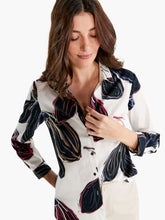 Load image into Gallery viewer, A bold oversized floral print on a brilliant white background creates an artistic and modern style top that stands out all on its own. A classic button-down silhouette with a button front, shirt collar, and full sleeves. Tuck it in or wear it loose where the hem will sit slightly below the hip. 
