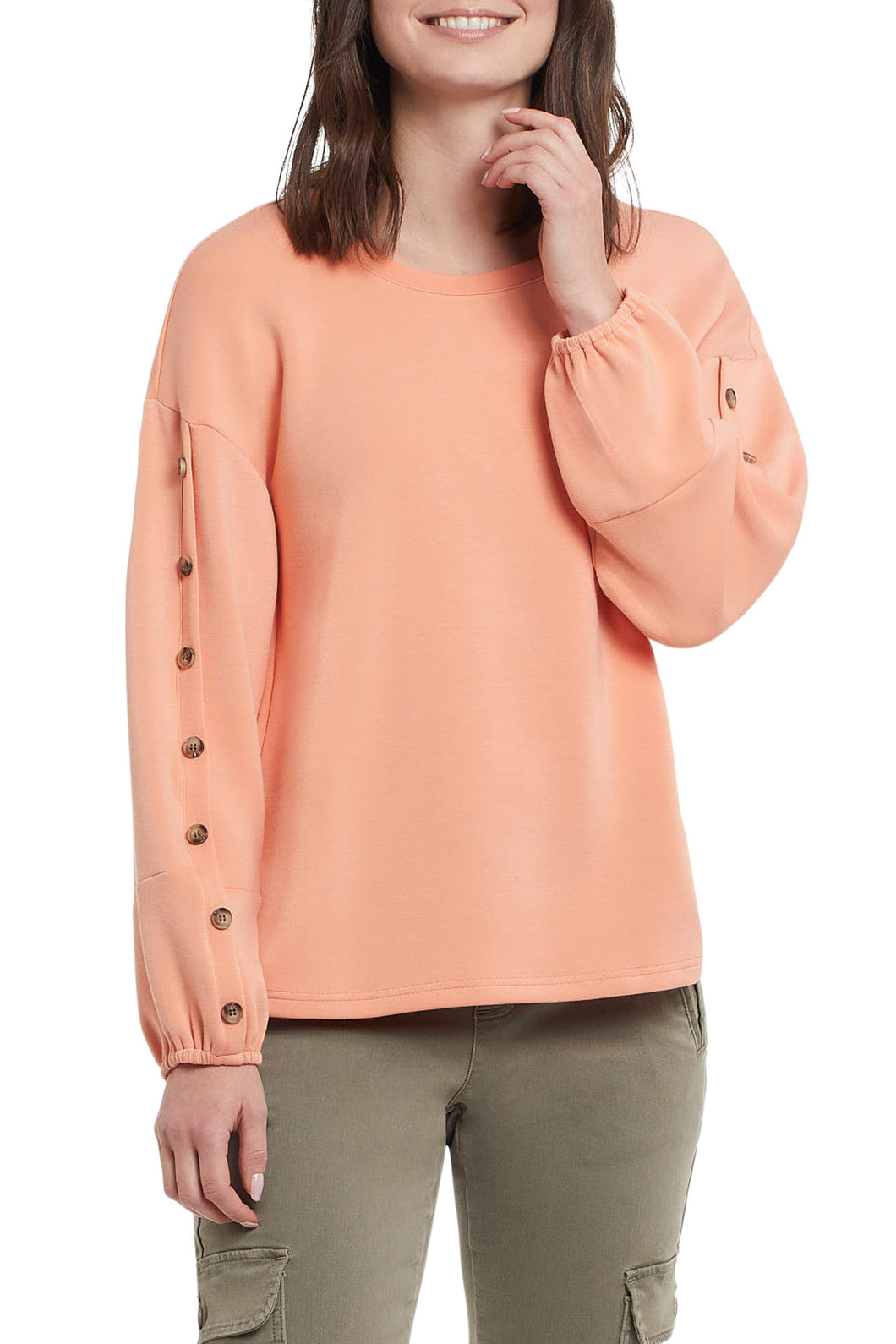 Sweatshirts with pizzazz replace plain sweatshirts of the past.  This stylish top with scuba knit fabric and just the right amount of embellishments, elevate any outfit. The gorgeous, warm Sunkissed color will take you back to those warm summer days when the weather is chilly.