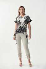 Load image into Gallery viewer, Pictures just do not do this gorgeous jean by Joseph Ribkoff justice!  A beautiful tan color fabric is enhanced with a sparkling lattice design in silver crystals mid-calf. Bottom of each leg is slightly frayed to give just the right amount of edge.  A stunning crop jean to dress up or wear casually.  Either way, you will be receiving compliments when you wear our Larisa!  Color-Denim Sand.  Silver buttons and hardware.  Silver crystals.
