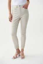 Load image into Gallery viewer, The latest in fashion is embellished and frayed jeans and our Christina Crystal Patch Jean by Joseph Ribkoff meets both of these trends. Patch embellishments in moonstone crystals can be found on both legs while slightly cuffed legs with moonstone embellishments dazzle with sparkle. Not your ordinary jean, this sand colored, soft denim jean will become your next favorite!

