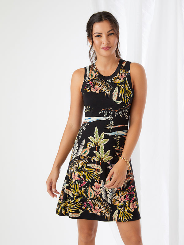 Whether you are going on vacation or going shopping and lunch with friends, this summer ready dress is the ideal style to wear. Designed in a tropical tone, the high neckline falls into a flattering A-line silhouette. Color- Black with tropical print in blue, green and pinks.