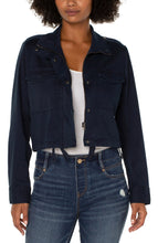 Load image into Gallery viewer, Liverpool&#39;s navy utility crop jacket, made with a stretch soft touch twill offers a modern take on a classic jacket.  The design offers a touch of sass mixed with edge to give you styling versatility!   Color- Federal Navy. Cropped. Collared. Double front patch pockets. Button and zip front closure. Button closure at wrists. Cinch waist drawstring.
