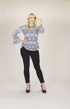 Load image into Gallery viewer, A gorgeous Mandala textured print comes alive on this fabulous bell sleeve top.  A beautiful white print pops on a navy sheer fabric, making this a very versatile top. Perfect paired with white bottoms or jeans and easily goes from day wear to an evening out.   Colors- White and Navy. Mandala textured print. Bell Sleeve. Slight Hi-lo design.  Slightly longer in the back.
