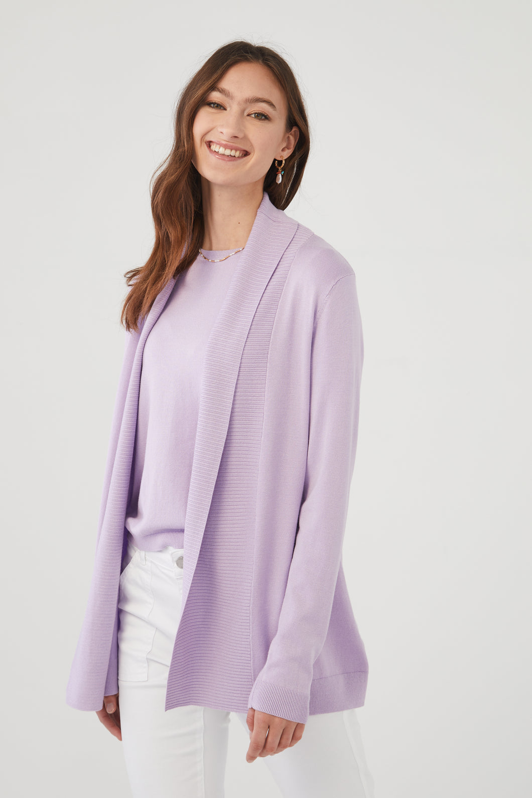 A must have style to include in your wardrobe, this fabulous wild pansy colored cardigan is a year-round staple.  Pair with our matching short sleeve top in the same color- Shana Short Sleeve Lightweight Sweater for a perfect look.  Color- Wild Pansy; lilac. Long sleeve. Open front.